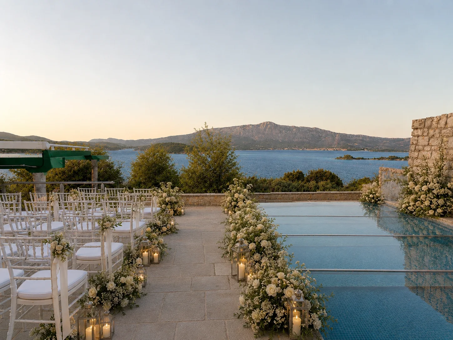 Private wedding ceremony aisle beside a pool overlooking the Adriatic Sea in Korčula, Croatia